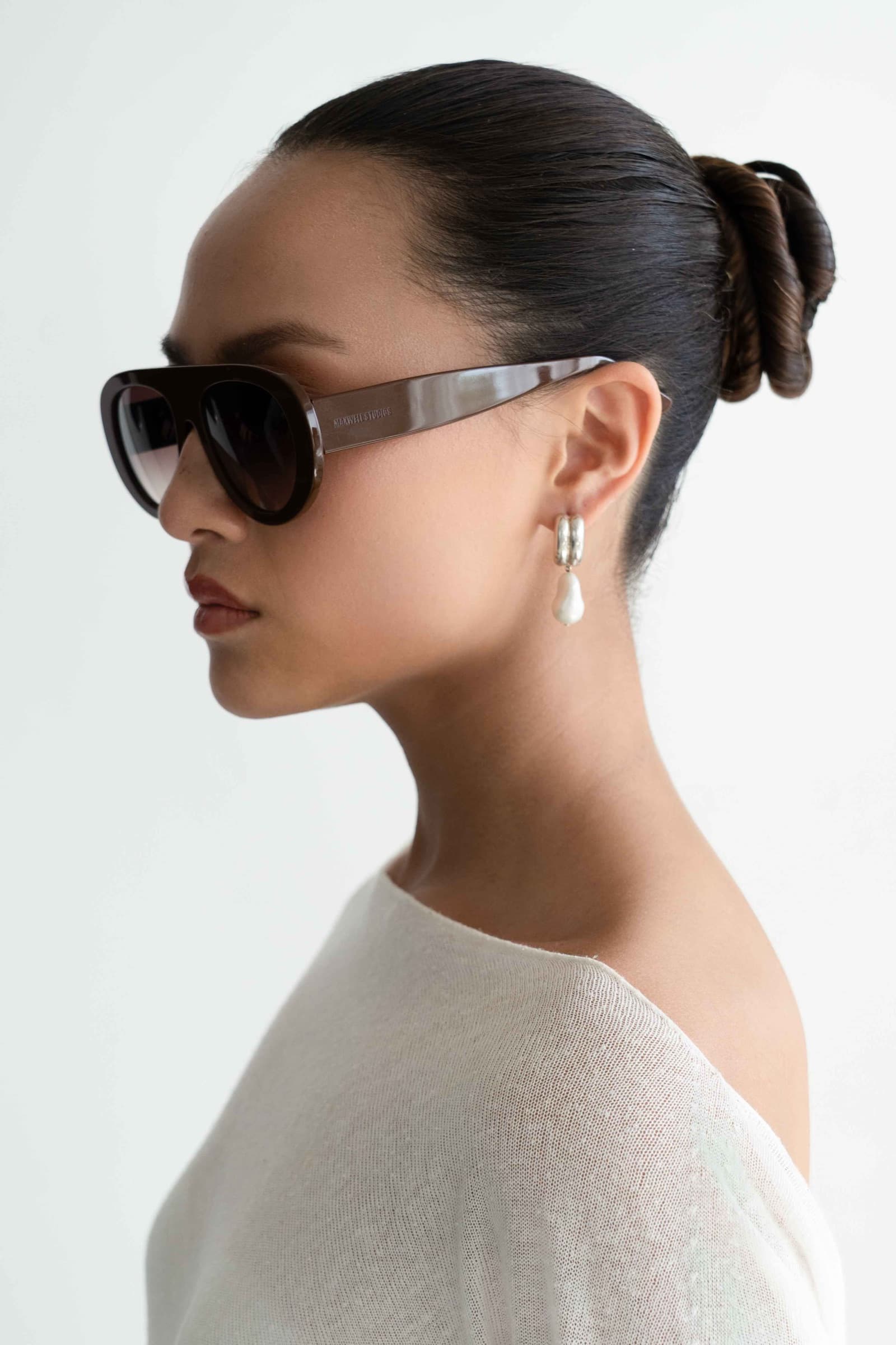 The Muse Brown sunglasses worn, side profile