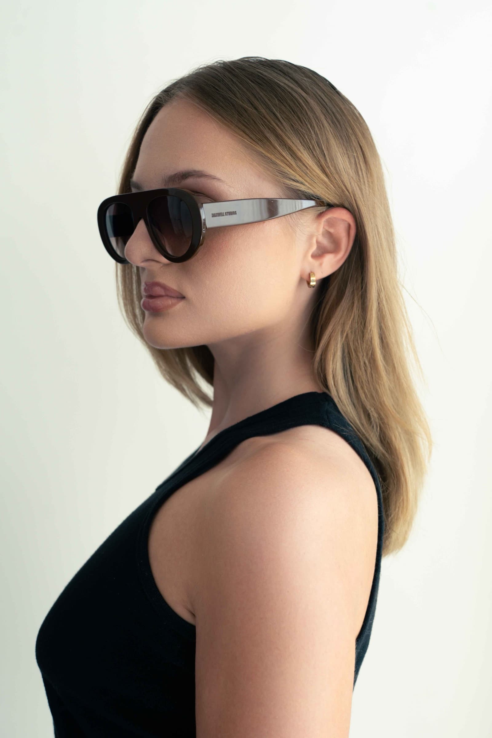 The Muse Brown sunglasses worn, side profile