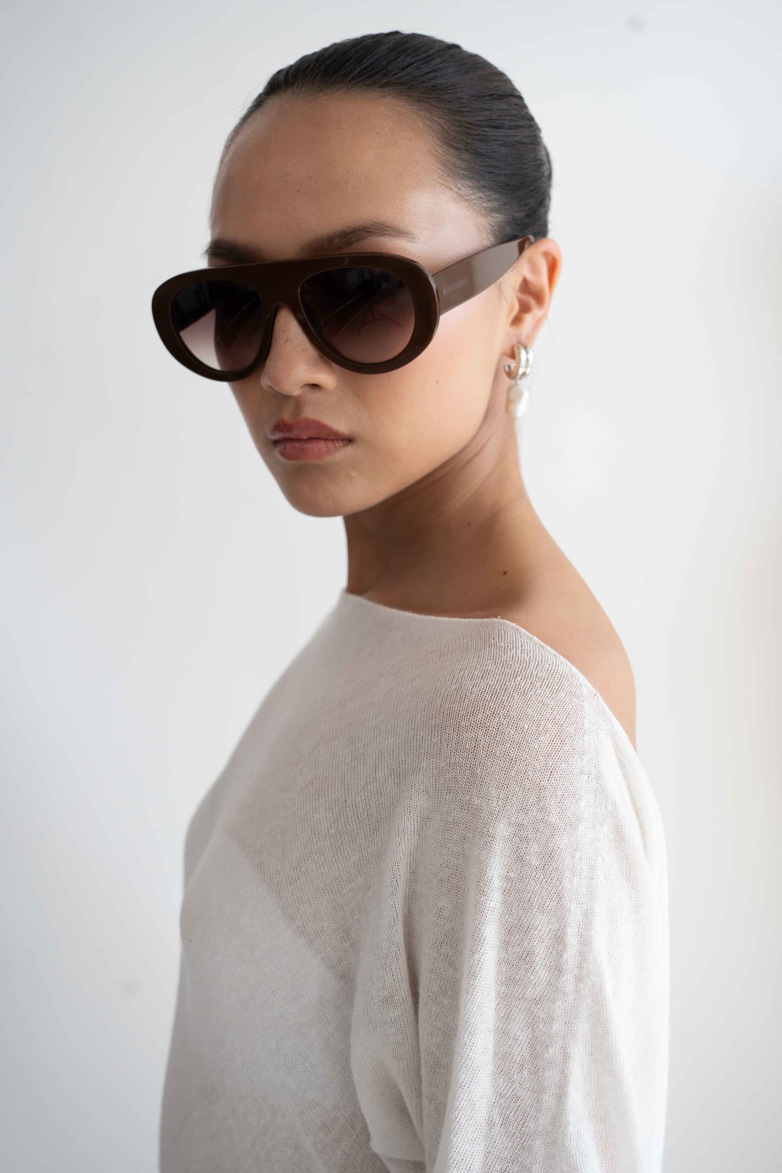 The Muse Brown sunglasses worn, side profile