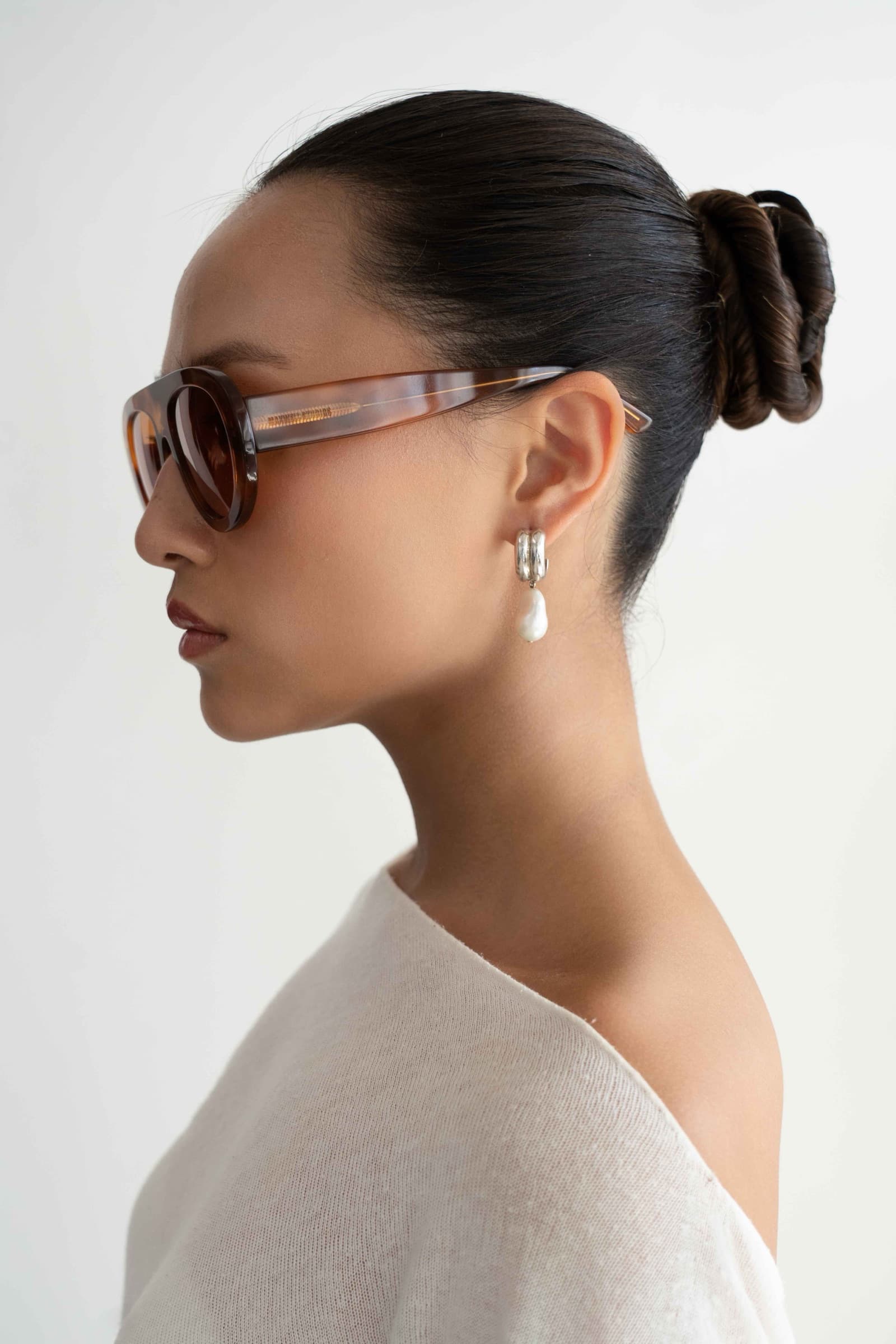 The Muse Orange Tortoise sunglasses worn, side profile
